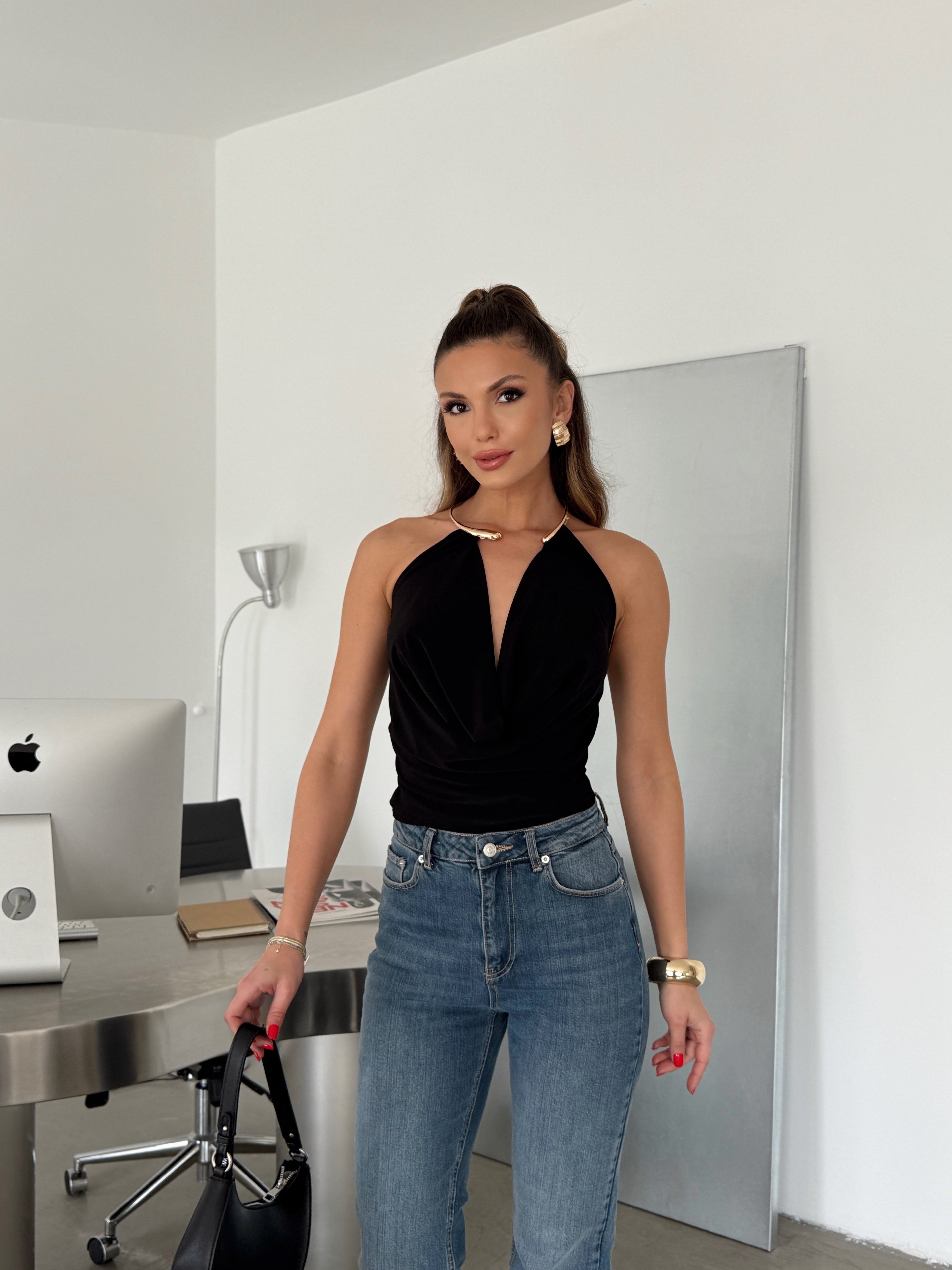 Top with an accent detail and open back