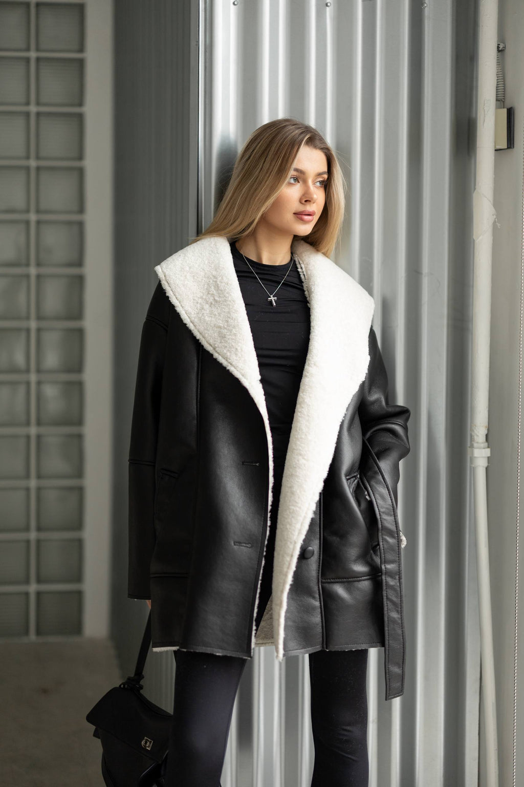 Elongated eco-leather shearling coat with teddy fur and a belt included