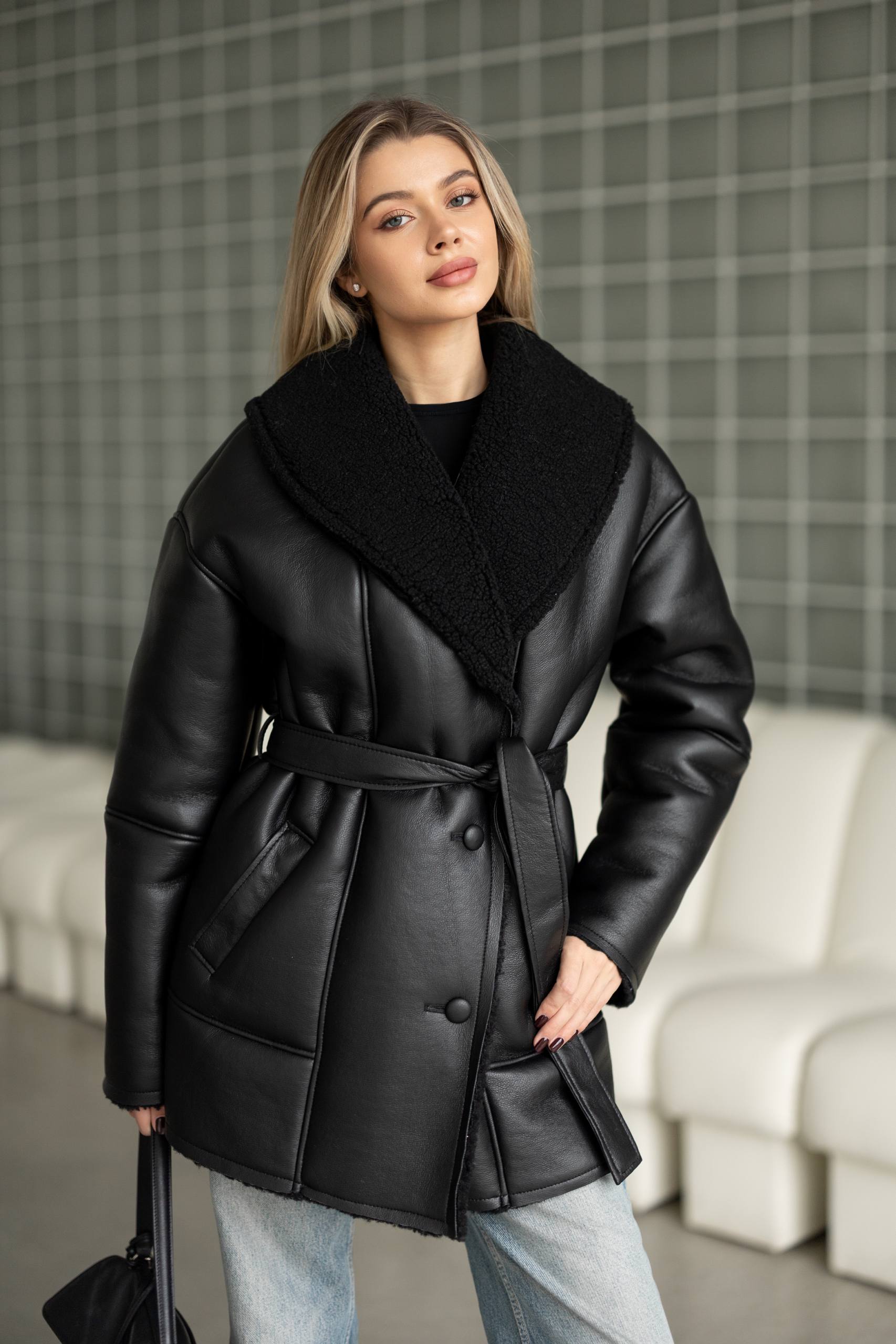 Elongated eco-leather shearling coat with teddy fur and a belt included