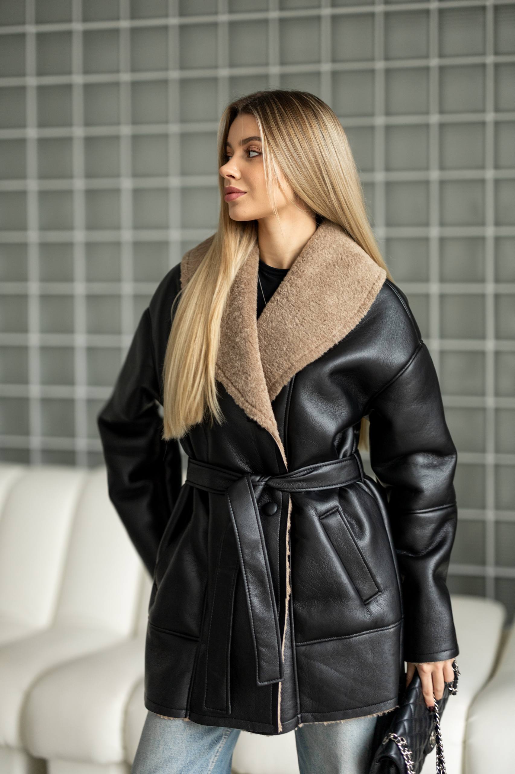 Elongated eco-leather shearling coat with teddy fur and a belt included