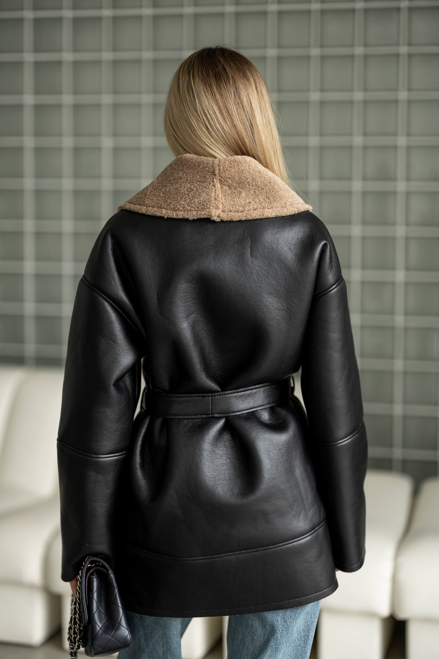 Elongated eco-leather shearling coat with teddy fur and a belt included