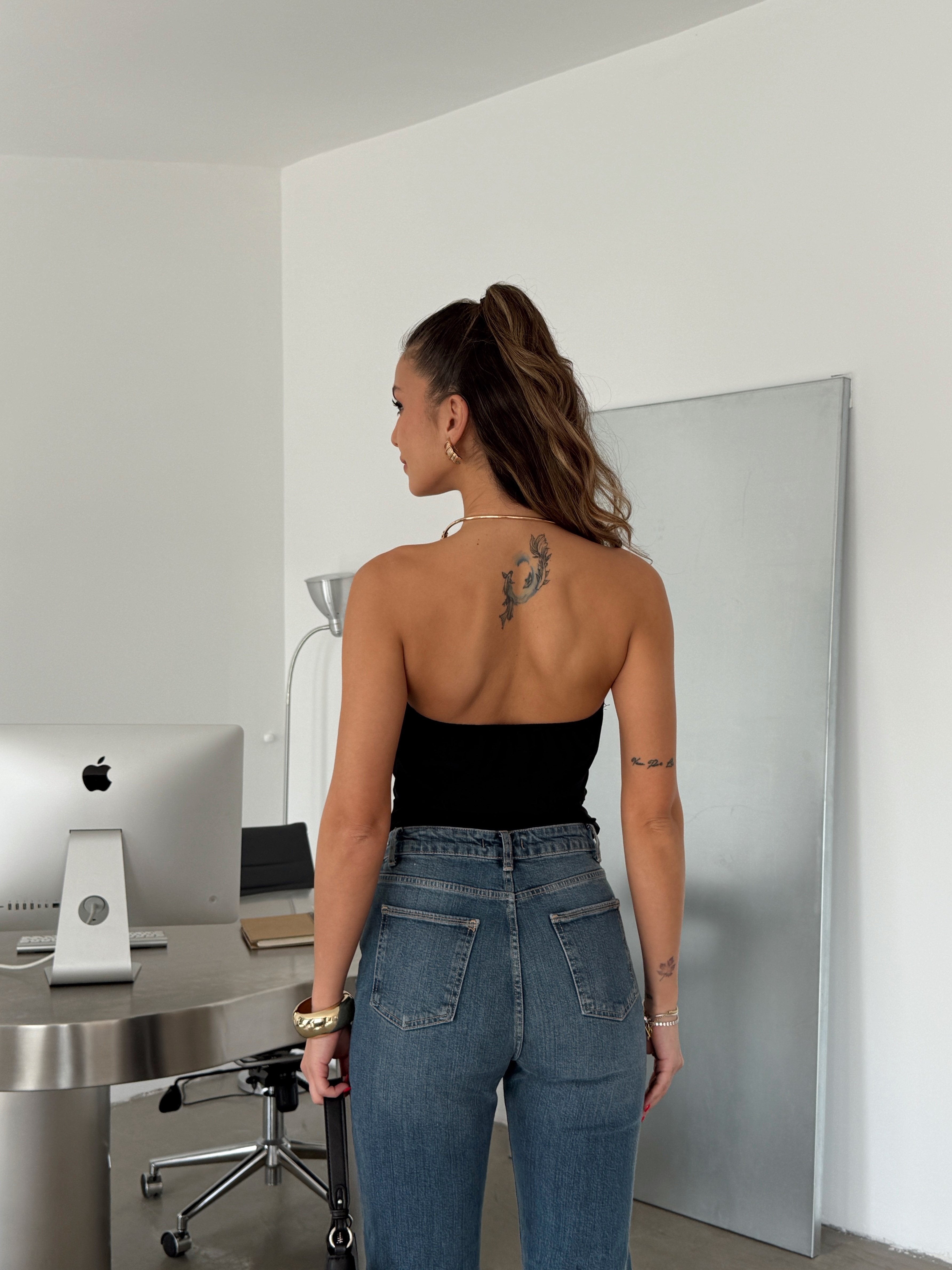 Top with an accent detail and open back