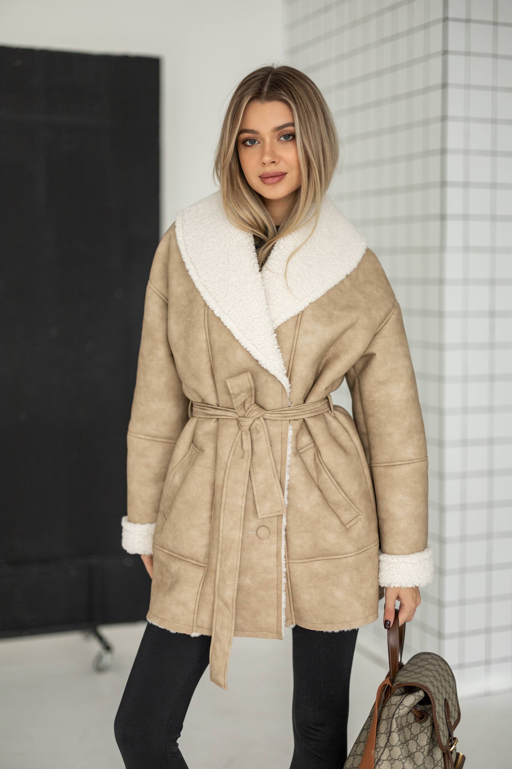Elongated eco-leather shearling coat with teddy fur and a belt included