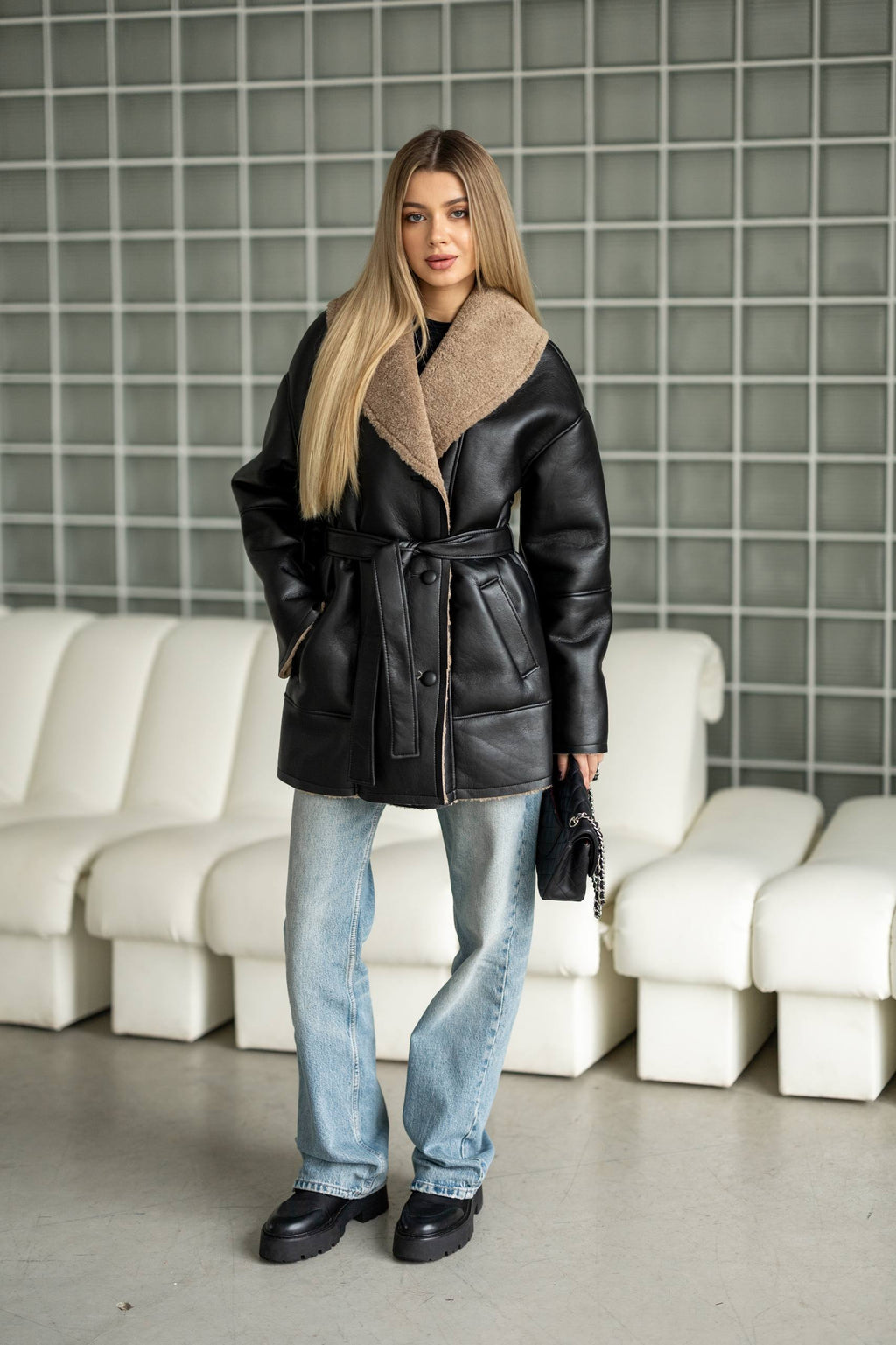 Elongated eco-leather shearling coat with teddy fur and a belt included