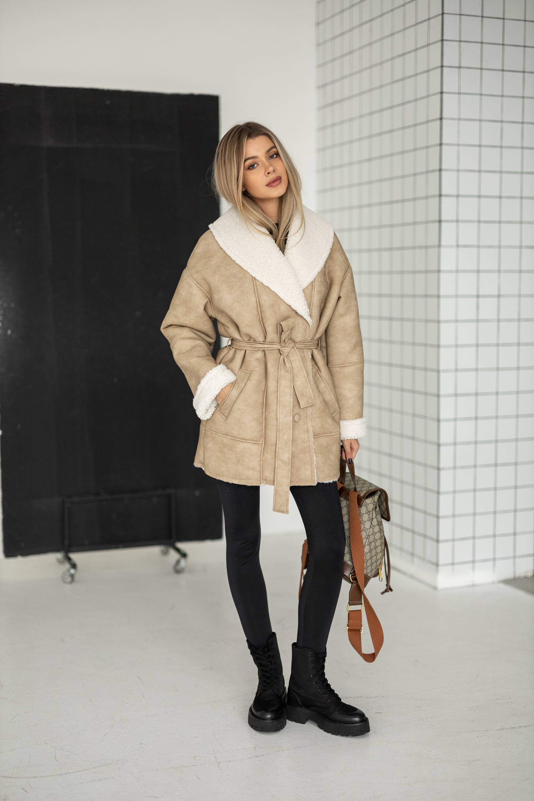 Elongated eco-leather shearling coat with teddy fur and a belt included