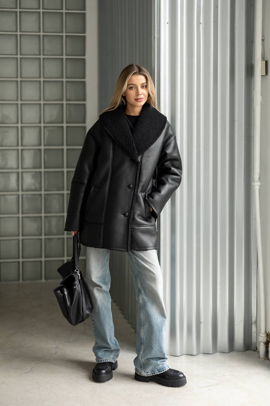 Elongated eco-leather shearling coat with teddy fur and a belt included