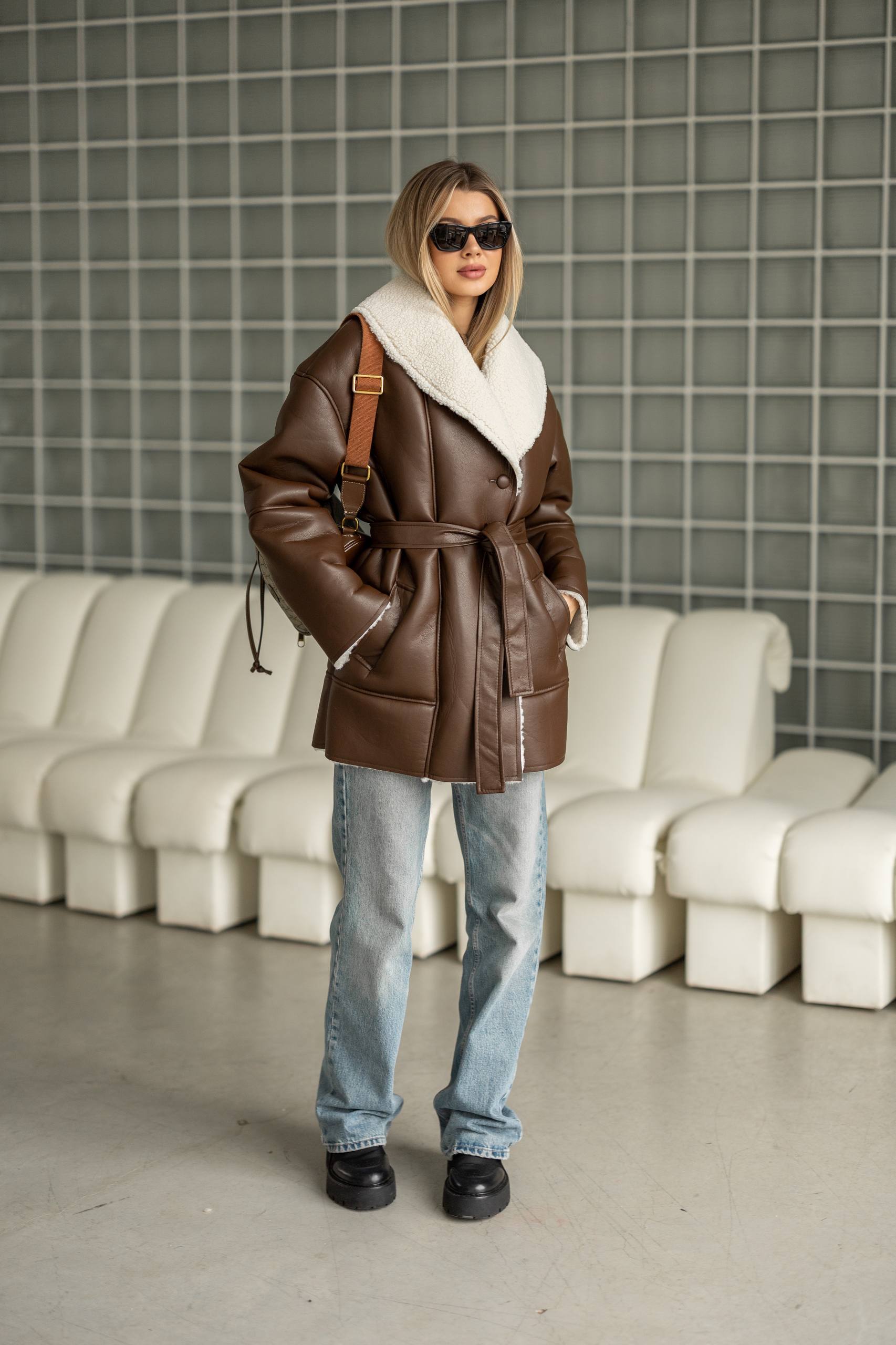Elongated eco-leather shearling coat with teddy fur and a belt included