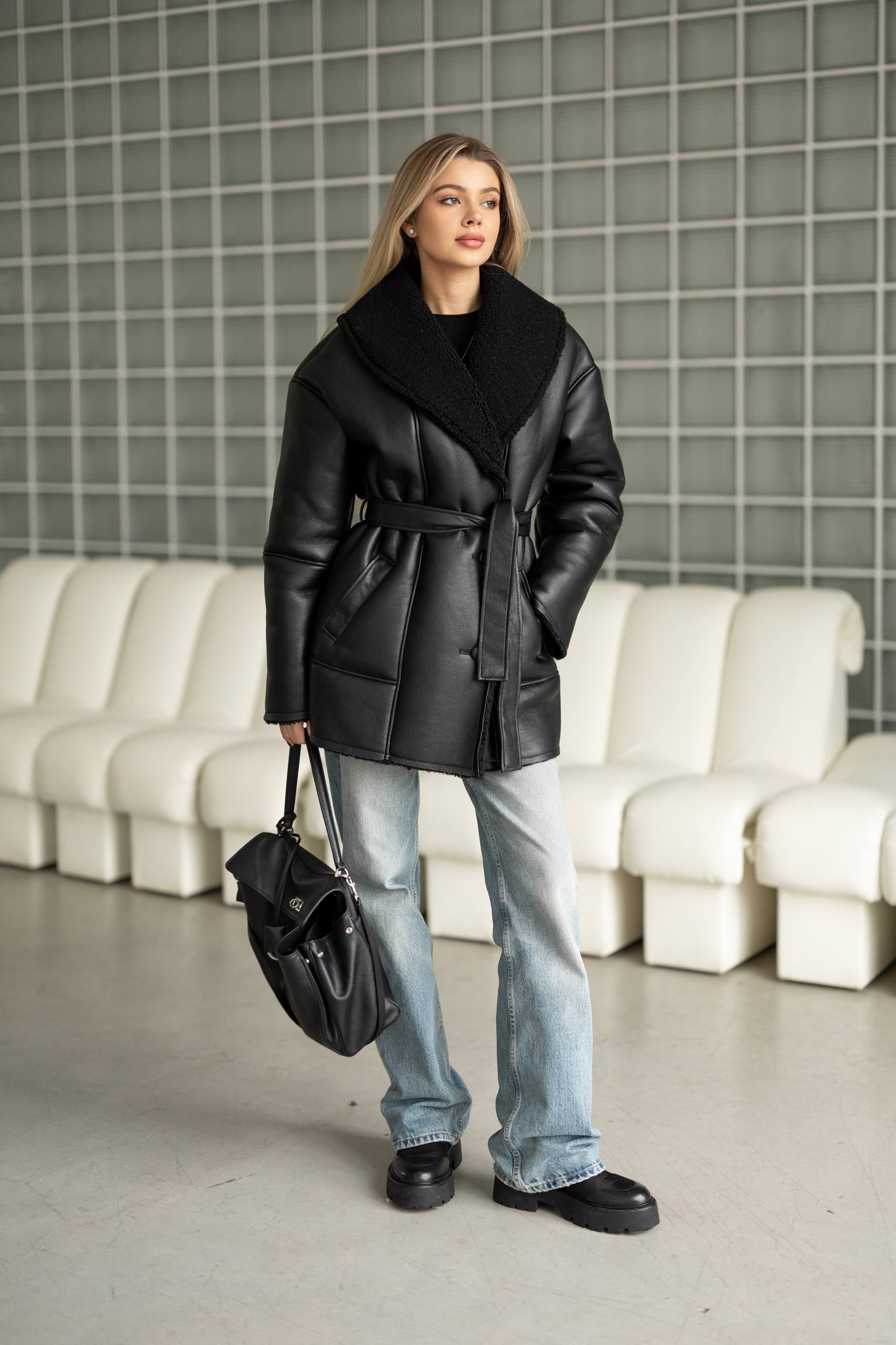 Elongated eco-leather shearling coat with teddy fur and a belt included