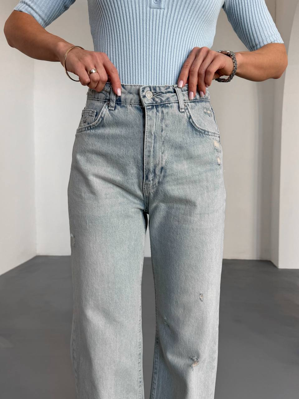 High-waist jeans with distressing